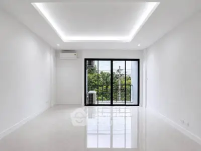 Spacious modern living room with large windows and scenic view
