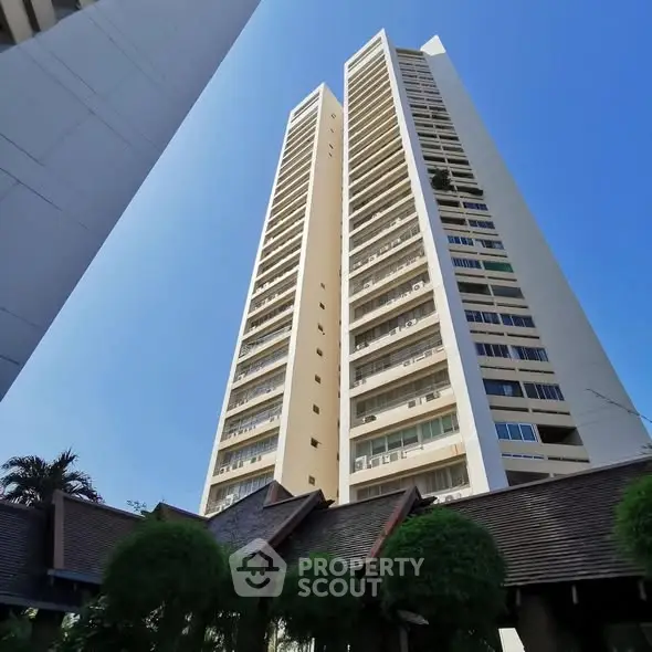 Stunning high-rise building with modern architecture against a clear blue sky.