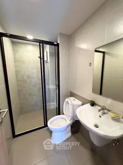 Modern bathroom with sleek shower and elegant fixtures