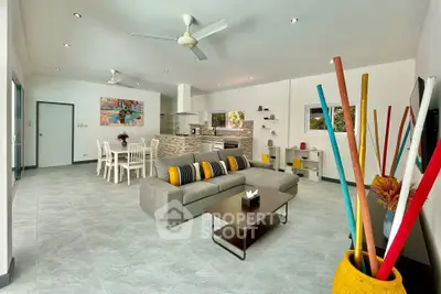 Spacious modern living room with open kitchen and stylish decor