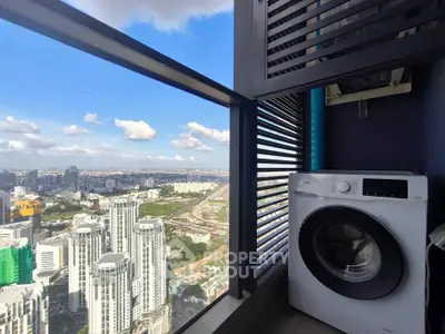 Stunning high-rise view with modern washing machine on balcony