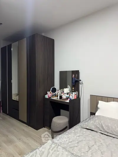 Modern bedroom with sleek wardrobe and vanity setup