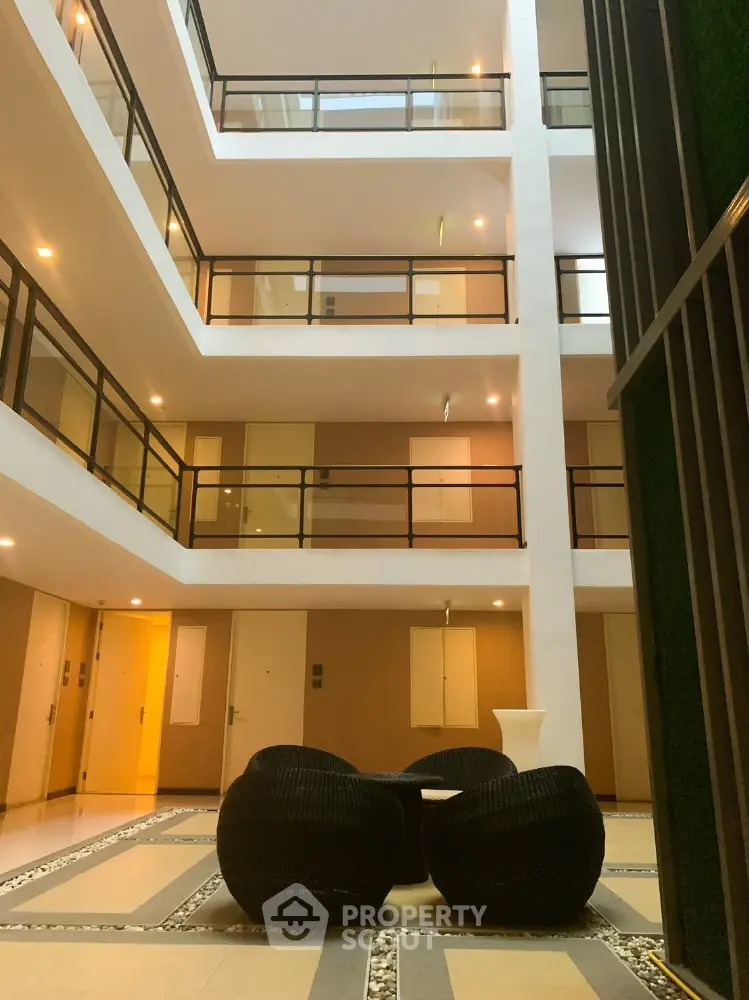 Modern apartment building interior with stylish seating and elegant design