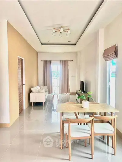 Bright and modern living room with elegant dining area and stylish decor