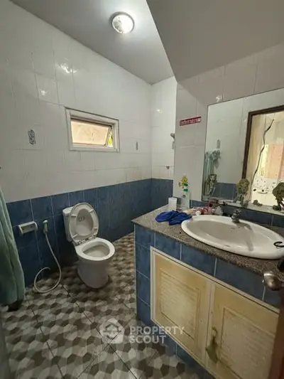Cozy bathroom with modern fixtures and stylish tile design, perfect for a comfortable living space.