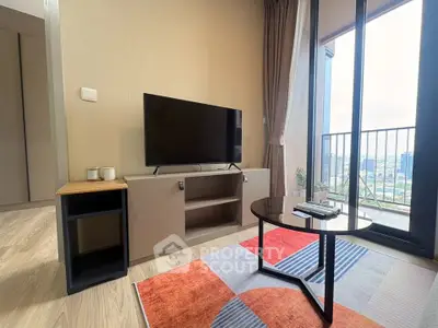 Modern living room with stylish decor and balcony view
