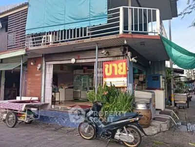 Charming street-level commercial property with potential, featuring a spacious balcony and vibrant neighborhood setting.