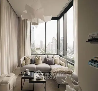 Luxurious modern living room with panoramic city views and elegant decor.