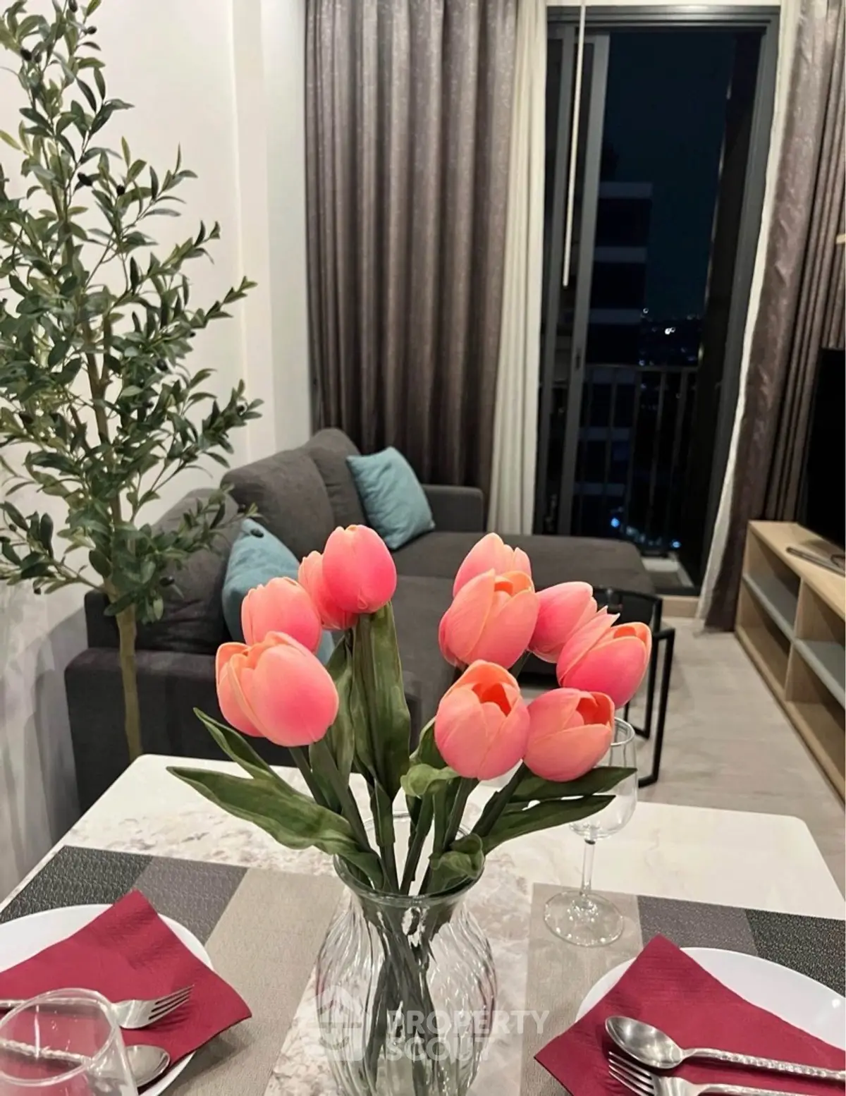 Chic living room with elegant decor and vibrant tulip centerpiece