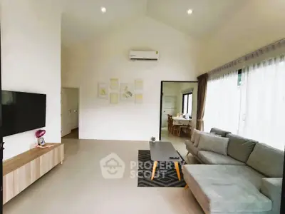 Spacious modern living room with large windows and stylish furniture