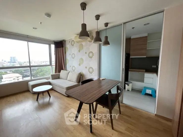 Modern living room with city view and open kitchen layout