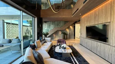Luxurious modern living room with elegant decor and large windows