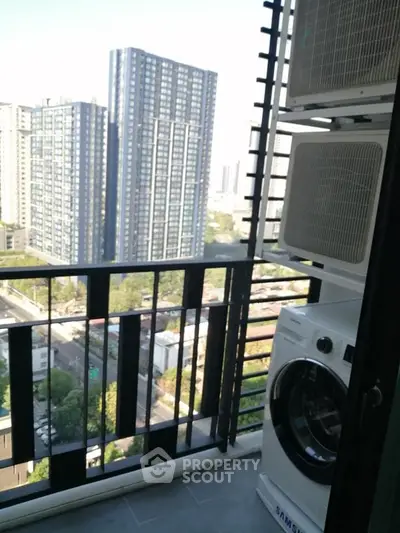 Modern balcony with city view and washing machine, perfect for urban living.
