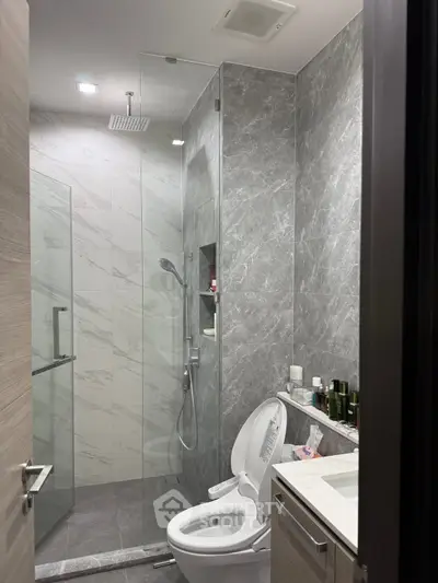 Modern bathroom with sleek design and glass shower enclosure