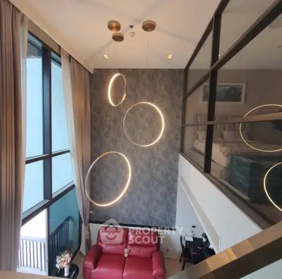 Modern duplex living room with high ceilings and stylish lighting