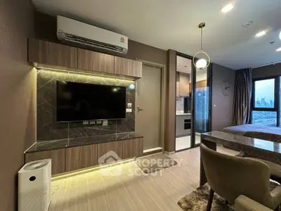 Modern living room with sleek design, featuring wall-mounted TV and stylish furniture, perfect for urban living.