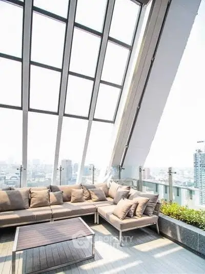 Luxurious rooftop terrace with panoramic city views and modern seating area.