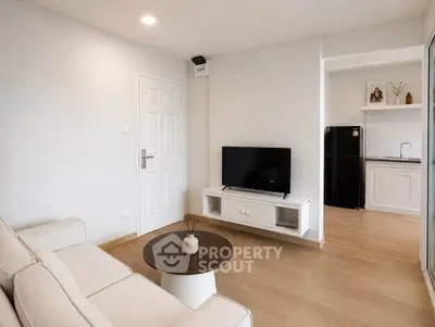 Modern living room with sleek design and open kitchen layout