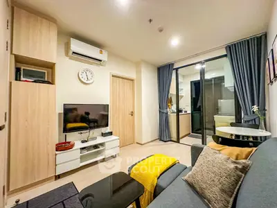 Modern living room with cozy decor and open kitchen view
