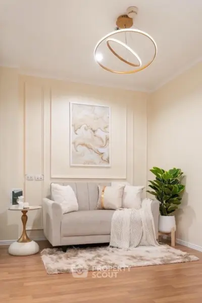 Elegant living room with modern chandelier and cozy decor