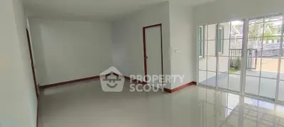 Spacious empty room with large windows and glossy floor tiles