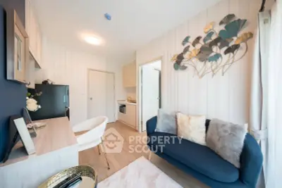 Modern living room with stylish decor and cozy seating in a contemporary apartment.