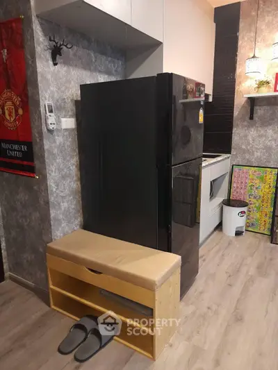 Modern kitchen with sleek black fridge and stylish decor