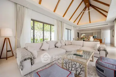Luxurious living room with vaulted ceiling and elegant decor in modern home