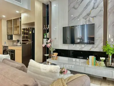 Luxurious modern living room with elegant decor and open kitchen layout