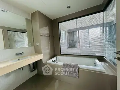 Luxurious bathroom with large bathtub and modern design