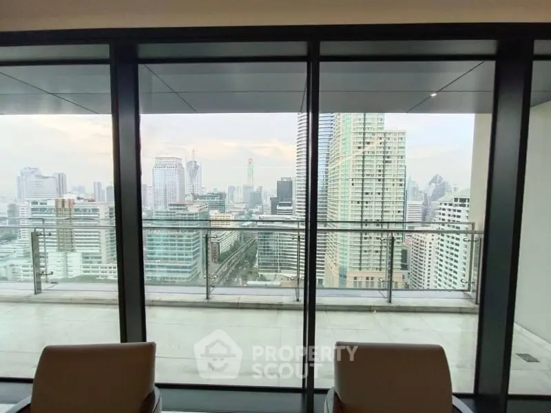 Stunning cityscape view from a modern high-rise apartment balcony, perfect for urban living.