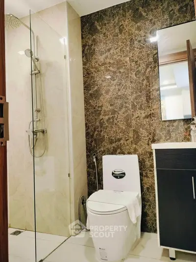 Luxurious bathroom with marble accents and modern fixtures