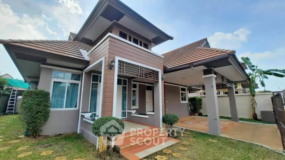 Charming modern house with spacious driveway and lush garden in serene neighborhood.