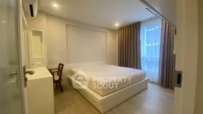 Spacious modern bedroom with natural light and elegant decor