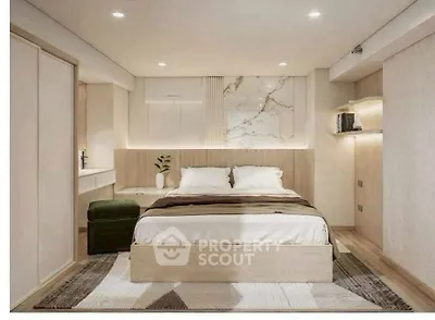 Modern bedroom with elegant decor and ambient lighting, featuring a cozy bed and stylish furnishings.