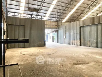 Spacious industrial warehouse with high ceilings and ample natural light
