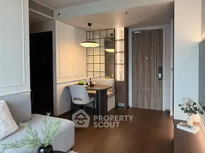 Modern living room with stylish decor and dining area in a cozy apartment