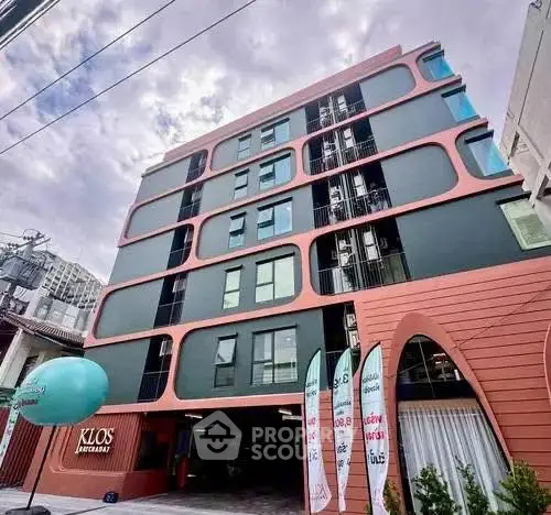 Modern architectural building with unique facade design and urban appeal.