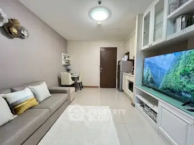 Modern living room with cozy sofa and open kitchen layout