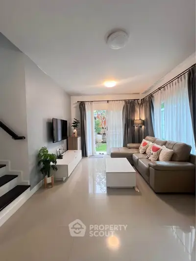 Spacious modern living room with sleek design and natural light