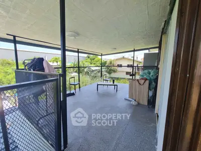 Spacious balcony with scenic view and modern design, perfect for relaxation.