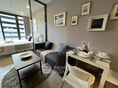 Modern studio apartment with cozy living area and stylish decor