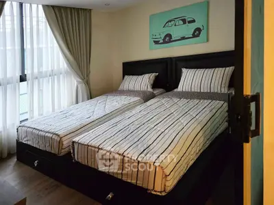 Cozy bedroom with twin beds and stylish decor in modern apartment