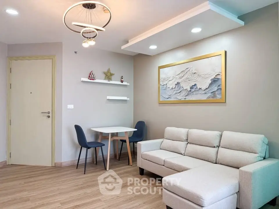 Modern living room with stylish decor and cozy seating area, perfect for relaxation and entertaining.