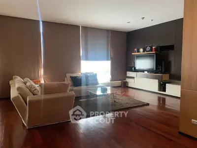 Spacious modern living room with elegant furniture and entertainment center