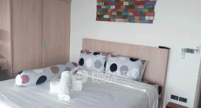 Modern bedroom with stylish decor and cozy bedding