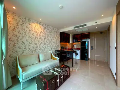 Stylish living room with elegant wallpaper and modern kitchen in open layout