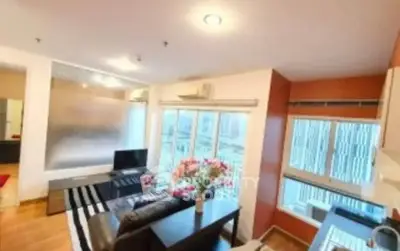 Modern living room with open kitchen and large windows in stylish apartment