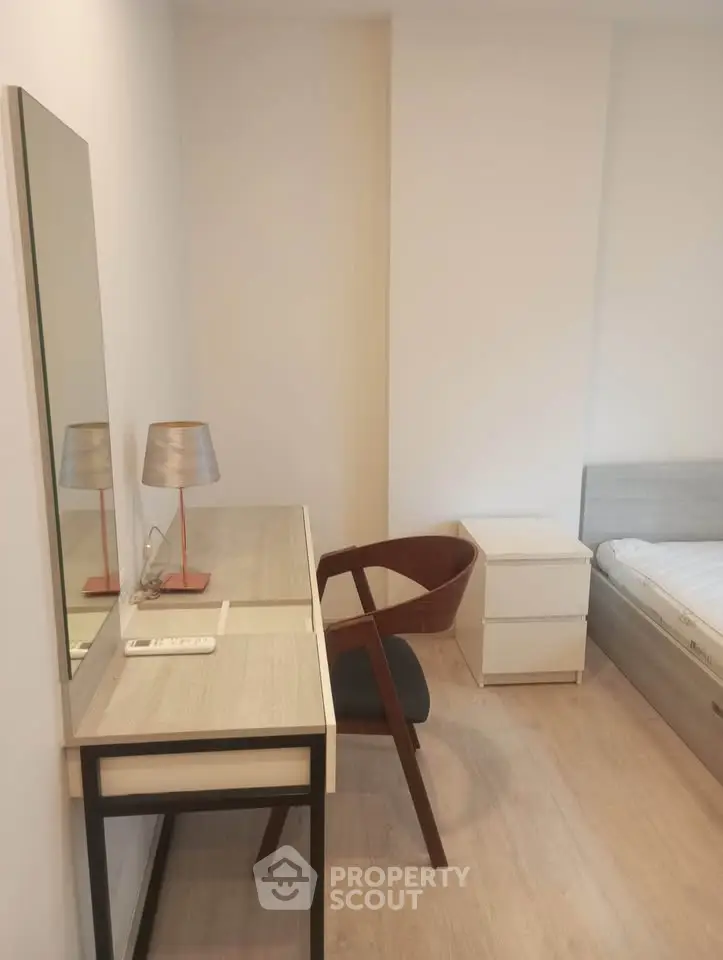 Modern bedroom with stylish desk and chair, perfect for a cozy and functional living space.