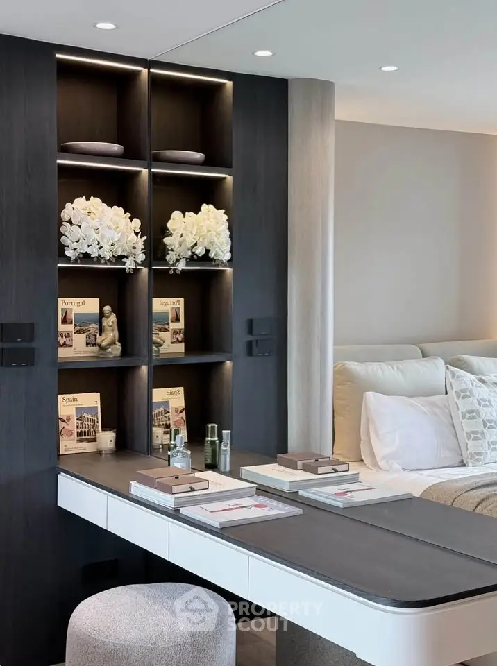 Luxurious modern living room with elegant decor and built-in shelving, perfect for sophisticated urban living.